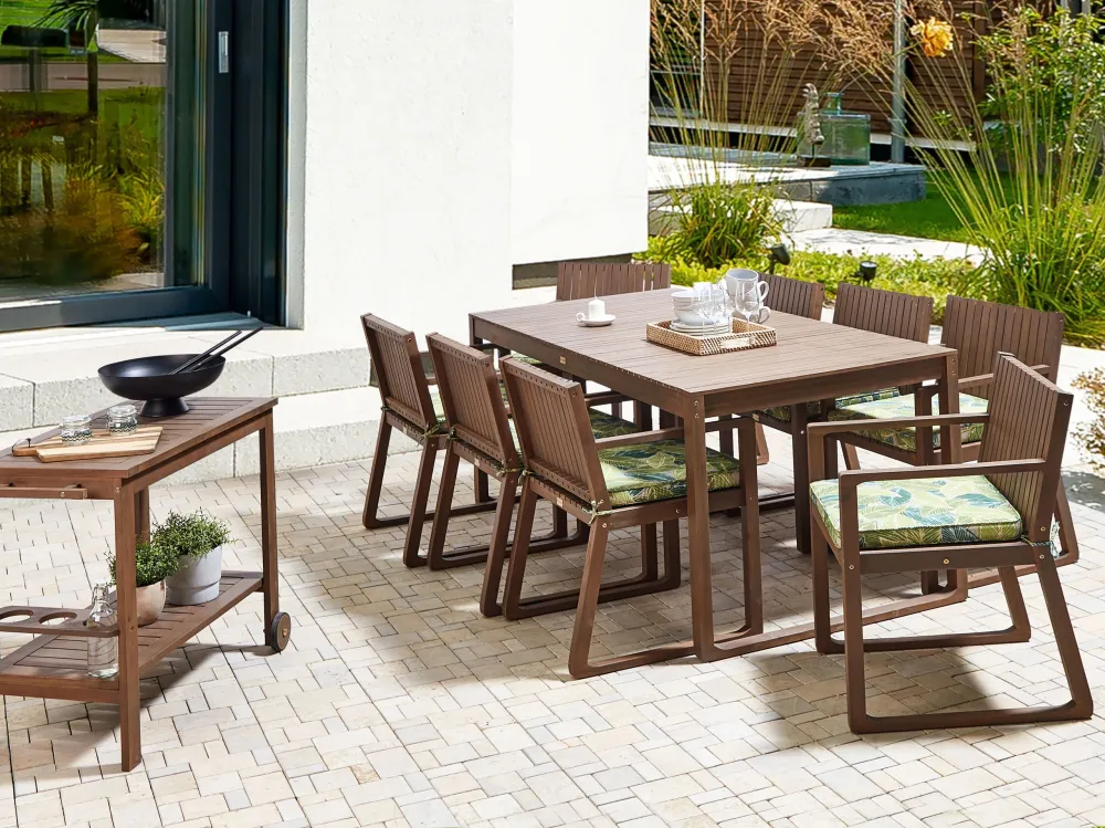 8 Seater Dark Acacia Wood Garden Dining Set Leaf Pattern Green Cushions SASSARI - Impermeabile e UV Resistente